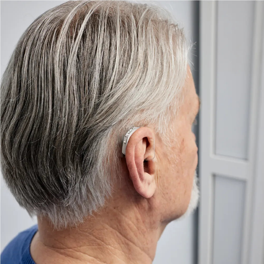 Old man wear hearing aids